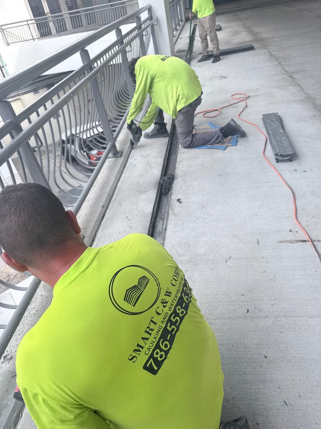 Expansion joint repair work on a commercial pedestrian deck