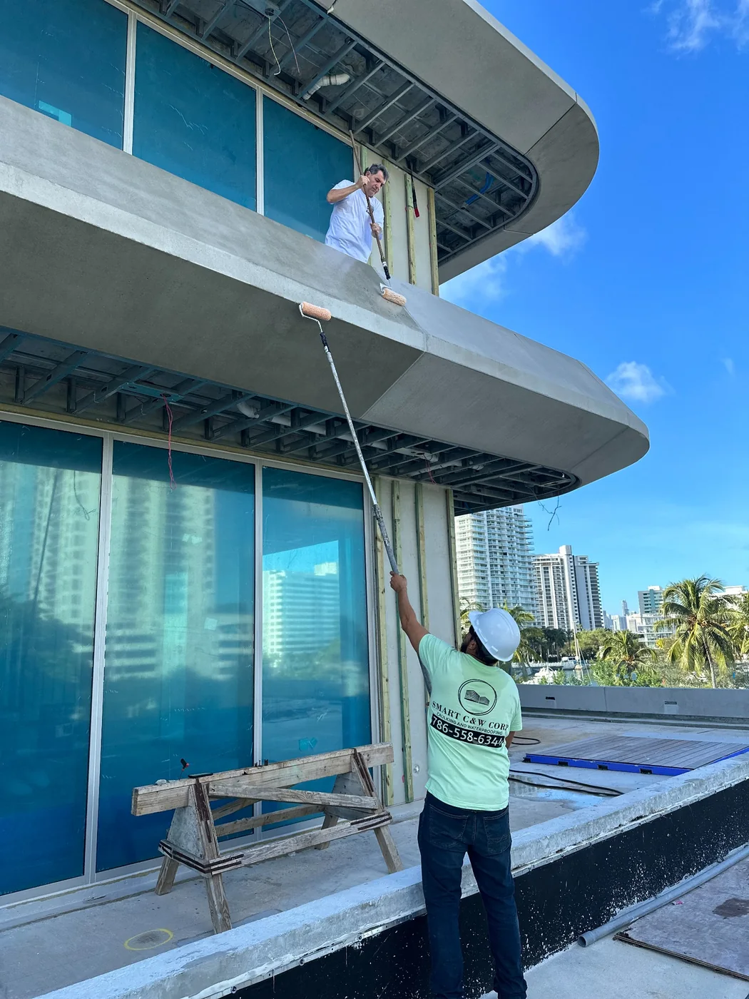 Exterior restoration and coating work on a modern South Florida building