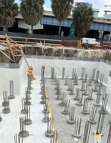 Below-grade waterproofing installation at a construction site