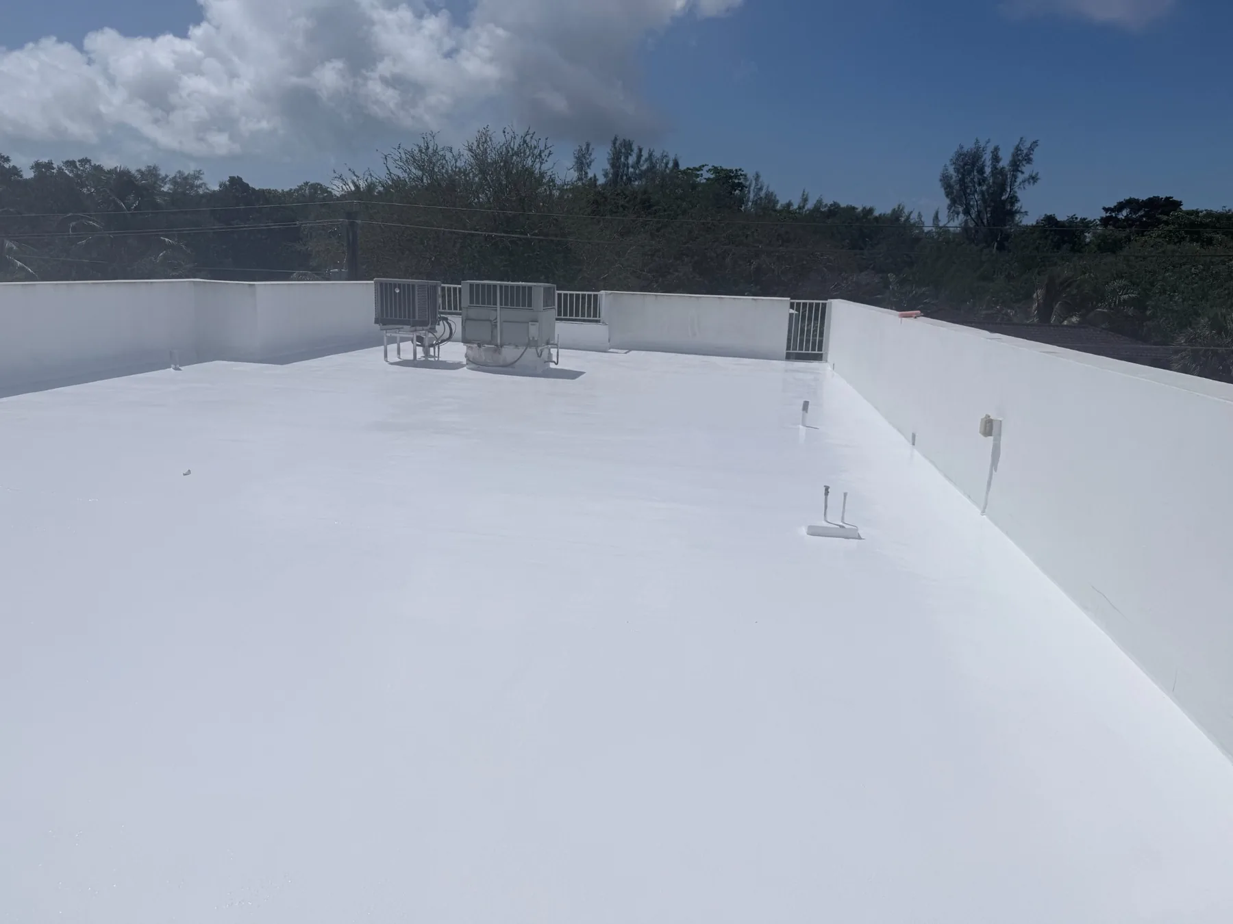 White waterproofing coating on a flat roof